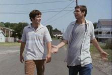 Ryan and Barret talk while walking down a road